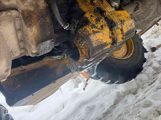 На John Deere 315 ищем вал привода кардана на передний мост. 